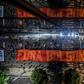 A giant banner reading "Get Out Bolsonaro" is displayed during a strike to protest proposed pension reforms
