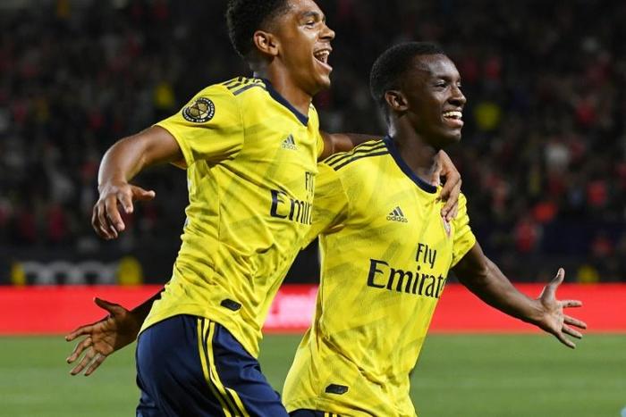 Late winner: Eddie Nketiah of Arsenal (R) celebrates with teammate Tyreece John-Jules (L) after scoring against Bayern Munich