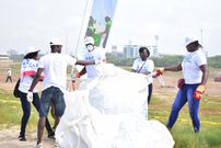 Employees bagging refuse collected