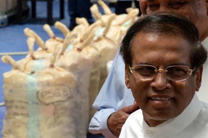 Sri Lankan president Maithripala Sirisena walks past seized cocaine in Colombo on April 1, 2019. Sirisena has called for the restoration of the death penalty for serious drug crimes