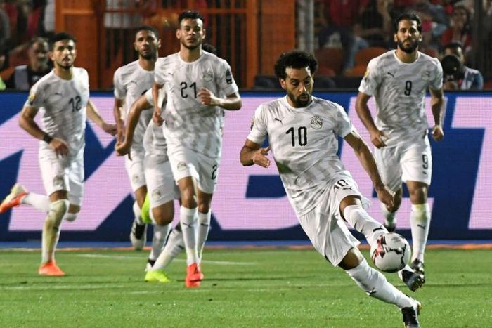 Egypt's forward Mohamed Salah (2nd-R) runs with the ball during the 2019 Africa Cup of Nations (CAN) Group A football match between Uganda and Egypt at the Cairo International Stadium in the Egyptian capital on June 30, 2019.