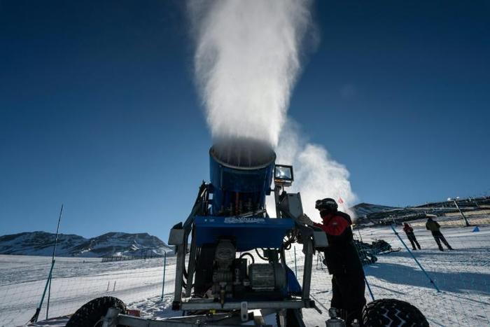 A cannon sprays artifical snow on a ski slope at El Colorado skiing center, in the Andes, some 30 km from Santiago