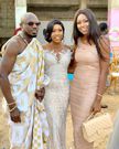Yvonne Nelson poses with bride and groom