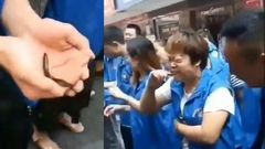 Chinese company makes employees eat raw fish, drink chicken blood for not meeting sales targets (video)