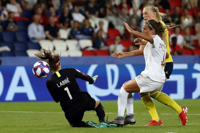 Stina Blackstenius beat Canada's Shelina Zadorsky and goalkeeper Stephanie Labbe to score