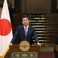 Iranian President Hassan Rouhani and Japanese Prime Minister Shinzo Abe give a joint press conference at the Saadabad Palace in Tehran