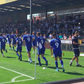 Bristol Rovers FC warm up in Junior Agogo tribute shirts