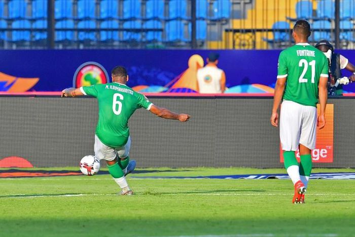 Madagascar's midfielder Marco Ilaimaharitra (L) kicks to score a goal during the 2019 Africa Cup of Nations (CAN) football match between Madagascar and Burundi at the Alexandria Stadium on June 27, 2019.