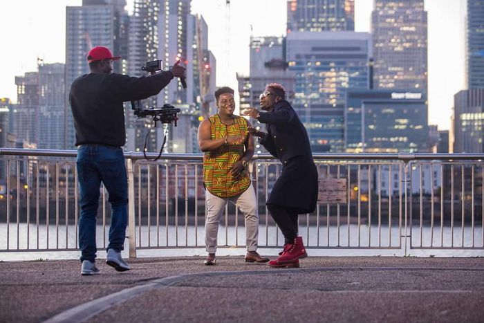 Kumi Guitar and Shatta Wale on set
