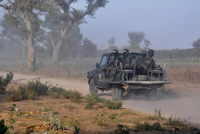 Members of the Cameroonian Rapid Intervention Force patrol on the outskirt of Mosogo in the far north region of the country where Boko Haram jihadists have been active since 2013, on March 21, 2019