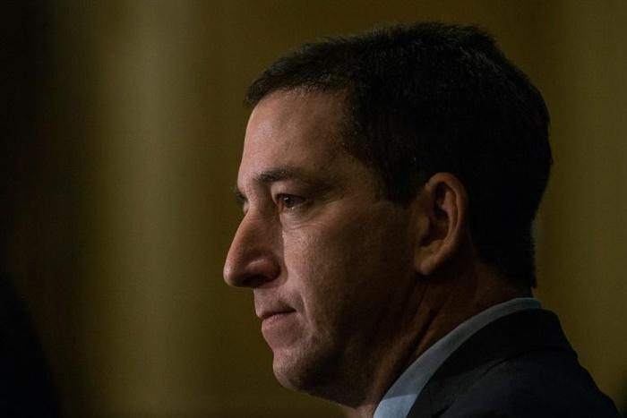 Journalist Glenn Greenwald says that despite the threats, he and his family do not plan to leave Brazil