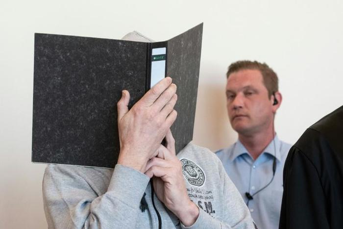 Defendant Andreas V. (L) is suspected of 298 sex crimes against 23 children at a campground in Luegde, western Germany