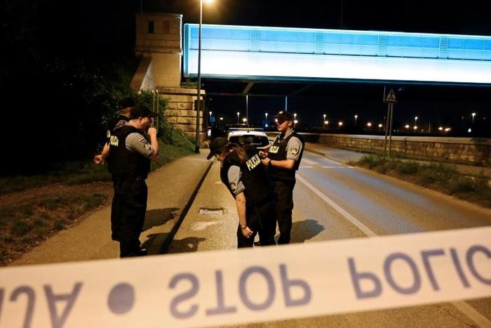 Local media reported the suspect was the former spouse of one of the victims, who was killed along with her partner and four children