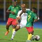 Ghana captain Andre Ayew (C) is outnumbered during an Africa Cup of Nations match against Cameroon in Egypt