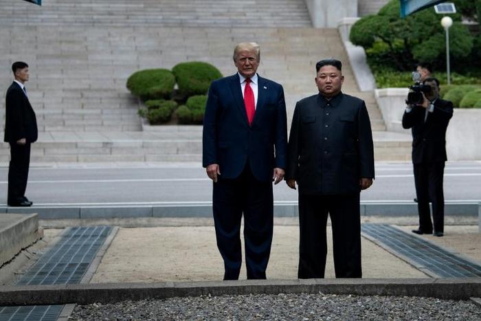 US President Donald Trump and North Korea's leader Kim Jong Un stand on North Korean soil while walking to South Korea in the Demilitarized Zone (DMZ) on June 30, 2019, in Panmunjom, Korea