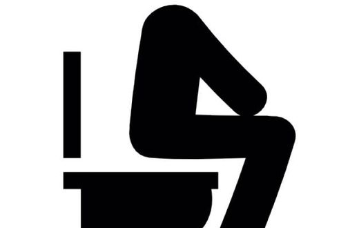 Silhouette of a man sitting on a toilet bowl