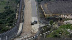 Israeli military vehicles patrol the border fence with Syria in the Israeli-annexed Golan Heights