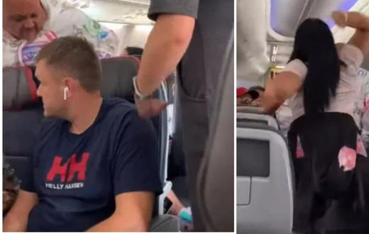 Angry woman beats up insatiable boyfriend on a plane for "looking at other" pretty "ladies" (video)