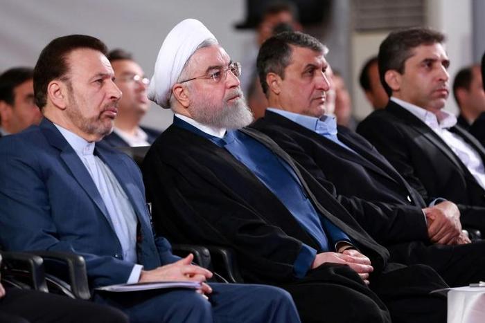A handout picture provided by the Iranian presidency on August 27, 2019, shows President Hassan Rouhani (2 L) attending a ceremony in the capital Tehran