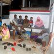 Residents gather outside their homes in Ternate after a strong magnitude 6,9 earthquake struck off Indonesia, triggering a brief tsunami warning that sent panicked residents fleeing to higher ground