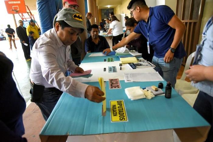 A man casts his vote at a polling station in Guatemala City