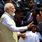Sri Lankan Prime Minister Ranil Wickremesinghe (right) welcomes Indian Prime Minister Narendra Modi at Bandaranaike International Airport in Katunayake