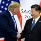 China's President Xi Jinping (R) shakes hands with US President Donald Trump before a bilateral meeting on the sidelines of the G20 Summit in Osaka on June 29, 2019
