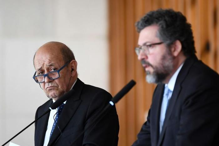 France's Foreign Minister Jean-Yves Le Drian, left, with his Brazilian counterpart Ernesto Araujo in Brasilia on July 29, 2019.