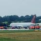 Firecrews attend an Omni Air International aircraft on the tarmac at Shannon Airport in County Clare, western Ireland, after a fire broke out on the undercarriage of the plane on the runway