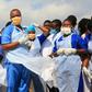 Tanzanian health workers wait for a military helicopter carrying victims of a fuel tanker explosion, at Jangwani grounds, in Dar es Salaam on August 11, 2019, the day after a the tanker exploded in the town of Morogoro