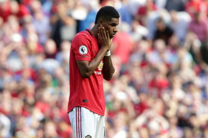 Manchester United striker Marcus Rashford reacts after mssing his penalty