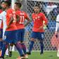A dejected Lionel Messi (right) leaves the field after he and Chile's Gary Medel were sent off during the Copa America third-place match