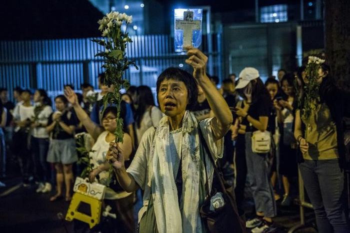 Overnight, a group of around 2,000 protestors held a vigil outside the government offices, with some singing hymns