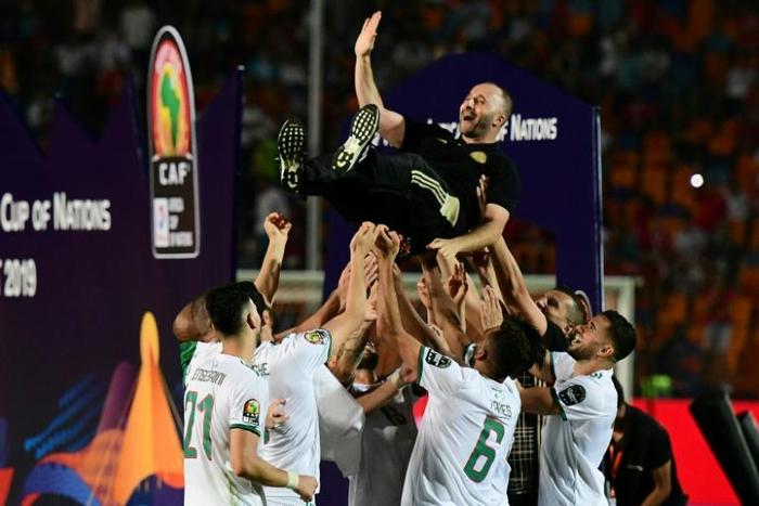 Djamel Belmadi celebrates with players