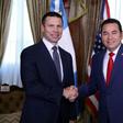 US acting Secretary of Homeland Security Kevin McAleenan (L) shakes hands with Guatemalan President Jimmy Morales at the Culture Palace in Guatemala City on August 1, 2019