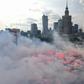 People lit flares as they observed a minute of silence to mark the 75th anniversary of the Warsaw Uprising against the Nazi occupiers during World War II