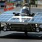 A Cypriot competitor steers his solar car during the Cyprus Institute's solar car challenge in Nicosia on June 23, 2019