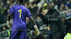 Cameroon coach Clarence Seedorf instructs goalkeeper Andre Onana during a 1-0 friendly loss to Brazil in England last November