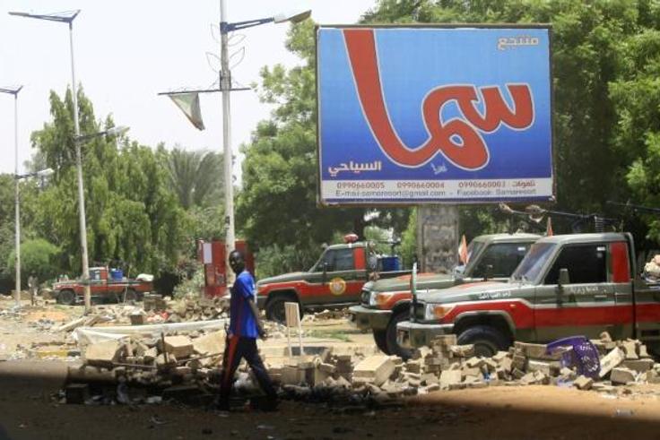 Fewer people than usual were on the streets of Khartoum, patrolled by heavily armed paramilitaries