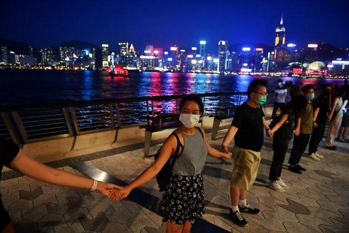 Hong Kong's skyscraper-studded harbourfront as well as several famous shopping districts were lined with peaceful protesters
