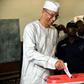 Former prime minister Lionel Zinsou (L), who lives in France, was found guilty of using false documents and "exceeding" spending limits in his 2016 presidential bid