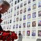 White House national security adviser John Bolton lays flowers at a memorial for those killed in Ukraine's war against Russia-backed separatists