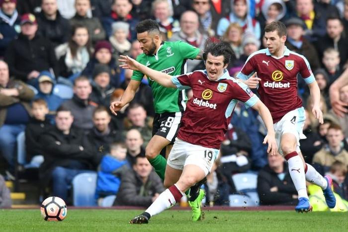 Joey Barton has been charged with actual bodily harm after an incident at Barnsley