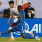 Mexico's Uriel Antuna (L) vies for the ball with Martinique's Samuel Camille (R) during their CONCACAF Gold Cup Group A match in Charlotte, North Carolina