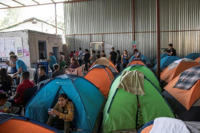 People live in tents in the crowded Juventud 2000 migrant shelter in Tijuana, Mexico
