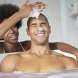 Couple sharing a bath [Credit - Madamenoire]