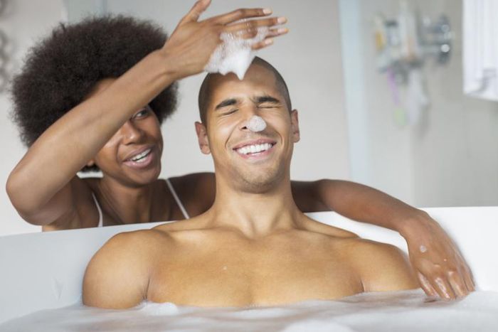 Couple sharing a bath [Credit - Madamenoire]