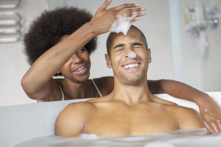 Couple sharing a bath [Credit - Madamenoire]