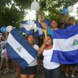 Friends and neighbours celebrate after student leader Edwin Carcache (not pictured) was released from prison, in Managua on June 11, 2019
