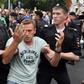 Opposition leader Alexei Navalny is detained by Russian police officers during a Moscow march to protest against polie abuse